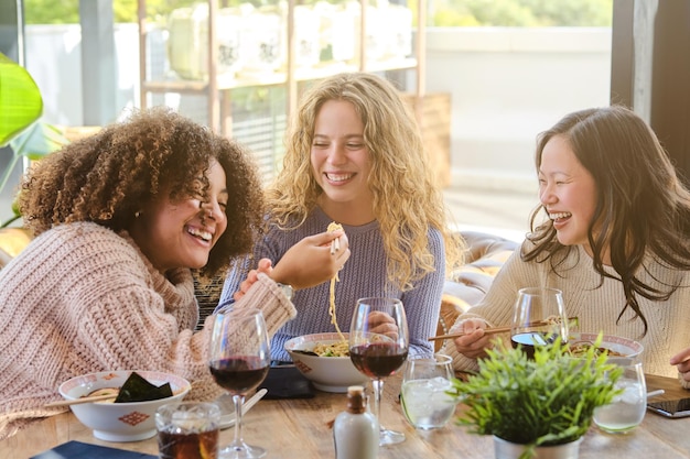 Happy people enjoying a meal together